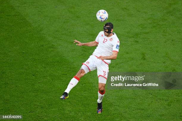 Ellyes Skhiri of Tunisia heads the ball during the FIFA World Cup Qatar 2022 Group D match between Denmark and Tunisia at Education City Stadium on...