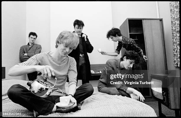 Group portrait of The Birthday Party in Leeds, United Kingdom, 23rd June 1981. L-R: Mick Harvey, Phill Calvert pouring water out of a kettle, Tracey...