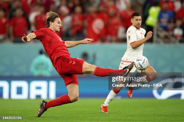 Joachim Andersen of Denmark stretches for the ball during the FIFA World Cup Qatar 2022 Group D match between Denmark and Tunisia at Education City...