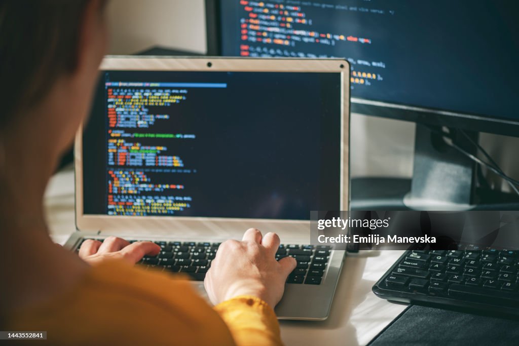 Close up of woman programmer working at home in his home office