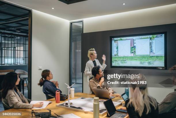 business person presentation on solar cell panel technology at meeting room. - sustainable business stock pictures, royalty-free photos & images