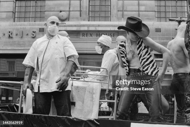 Two men dressed as a medic and a hospital patient on a float at the Lesbian and Gay Pride event, Regent Street St James, London, 24th June 1995.