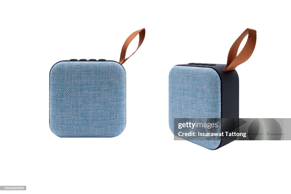 Portable wireless speaker isolated on white background. Concept listening to music on the street.