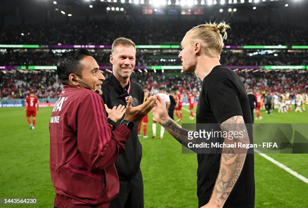 Simon Kjaer of Denmark argues with fourth official Said Martinez during the FIFA World Cup Qatar 2022 Group D match between Denmark and Tunisia at...