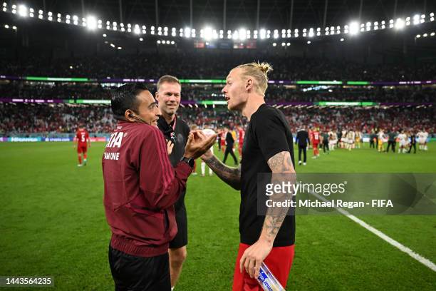 Simon Kjaer of Denmark argues with fourth official Said Martinez during the FIFA World Cup Qatar 2022 Group D match between Denmark and Tunisia at...