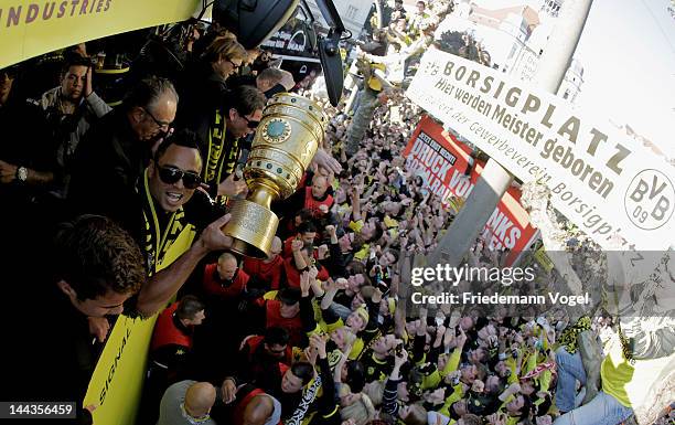 Antonio da Silva celebrates during a victory parade on an open top bus after winning the DFB Cup and Bundesliga Trophy, on May 13, 2012 in Dortmund,...