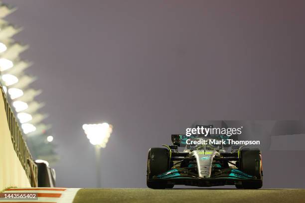 Lewis Hamilton of Great Britain driving the Mercedes AMG Petronas F1 Team W13 on track during Formula 1 testing at Yas Marina Circuit on November 22,...