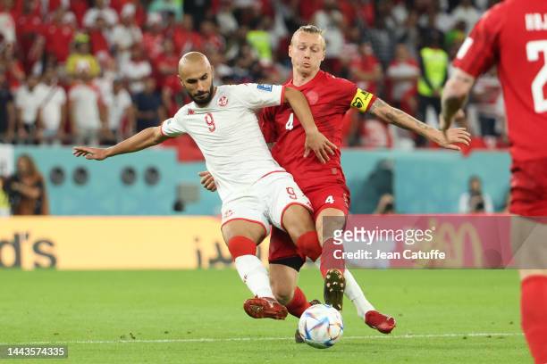 Issam Jebali of Tunisia, Simon Kjaer of Denmark during the FIFA World Cup Qatar 2022 Group D match between Denmark and Tunisia at Education City...