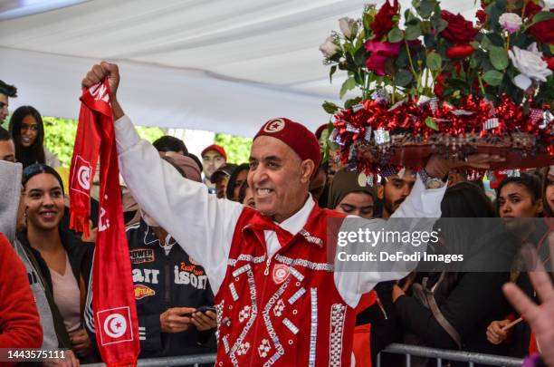 Tunisia fans cheer at Habib Bourguiba Avenue as they watch a live broadcast of Tunisia's opening group-round match versus Denmark on November 22,...