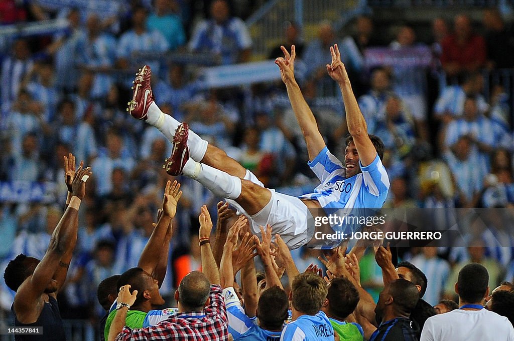 Malaga's Dutch forward Ruud van Nistelro