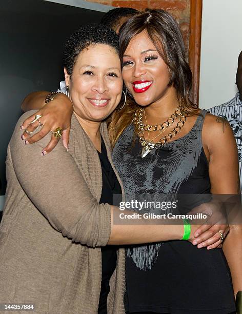 Rapper Eve poses with her mother Julie Wilch in the VIP room at Kung Fu Necktie on May 9, 2012 in Philadelphia, Pennsylvania.