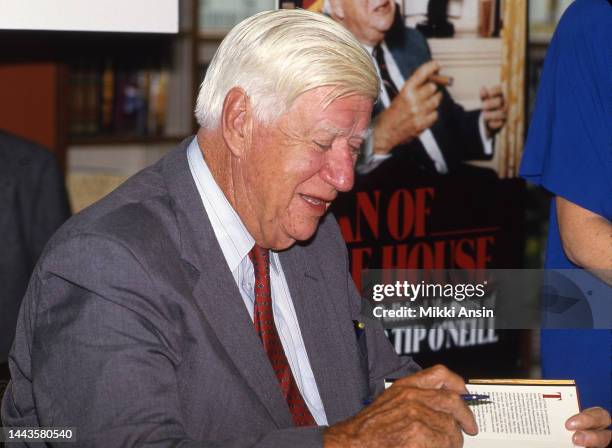 Close-up of former Speaker of the US House of Representatives Thomas Phillip 'Tip' O'Neill signs his autobiography 'Man of the House' at Harvard...