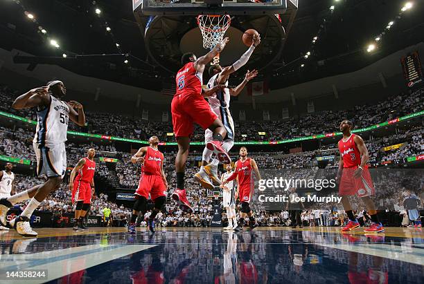 Mike Conley of the Memphis Grizzlies attempts a reverse layup against DeAndre Jordan of the Los Angeles Clippers in Game Seven of the Western...