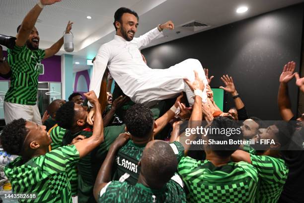 Prince Abdulaziz bin Turki Al-Faisal celebrates with players of Saudi Arabia after victory in the FIFA World Cup Qatar 2022 Group C match between...