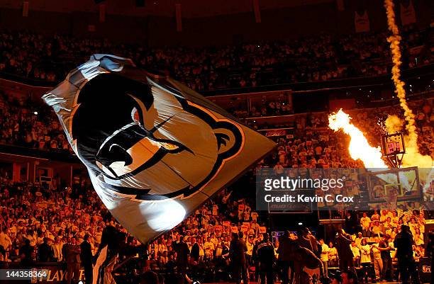 The Memphis Grizzlies mascot waves a giant flag prior to Game Seven of the Western Conference Quarterfinals in the 2012 NBA Playoffs between the...