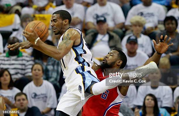 Mike Conley of the Memphis Grizzlies tosses up a shot against DeAndre Jordan of the Los Angeles Clippers in Game Seven of the Western Conference...