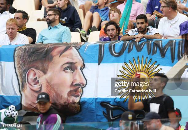 Banner with the image of Lionel Messi is displayed by the fans during the FIFA World Cup Qatar 2022 Group C match between Argentina and Saudi Arabia...