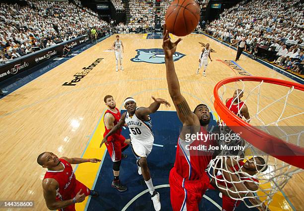 DeAndre Jordan of the Los Angeles Clippers reaches for the rebound in Game Seven of the Western Conference Quarterfinals against the Memphis...