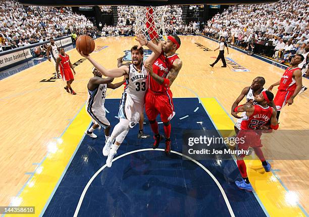 Marc Gasol of the Memphis Grizzlies goes to the basket against Kenyon Martin of the Los Angeles Clippers in Game Seven of the Western Conference...