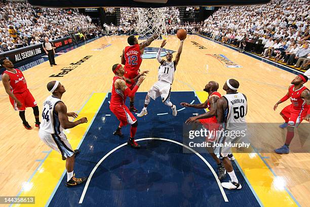 Mike Conley of the Memphis Grizzlies shoots against Eric Bledsoe of the Los Angeles Clippers in Game Seven of the Western Conference Quarterfinals...