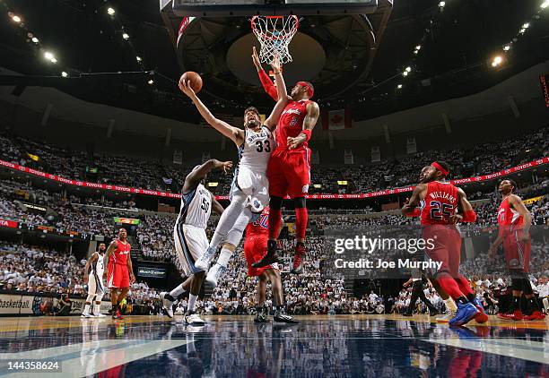 Marc Gasol of the Memphis Grizzlies goes to the basket against Kenyon Martin of the Los Angeles Clippers in Game Seven of the Western Conference...