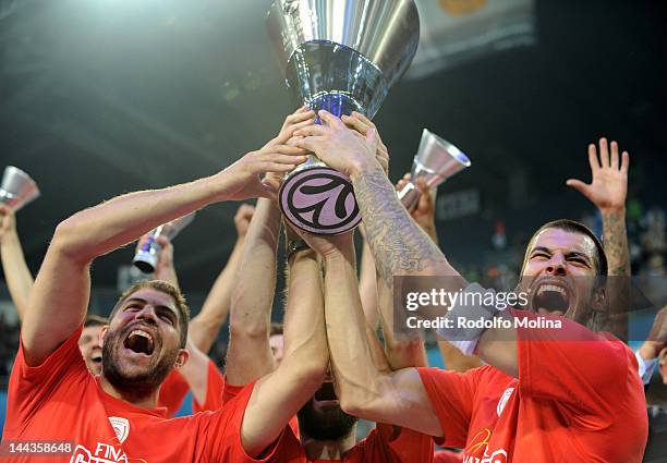 Georgios Printezis of Olympiacos Piraeus lifts the trophy after scoring the winning basket at the end of the Turkish Airlines EuroLeague Final Four...