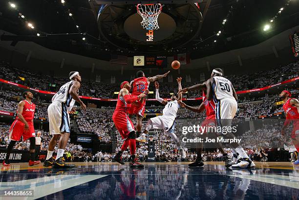 Mike Conley of the Memphis Grizzlies attempts a shot against Eric Bledsoe of the Los Angeles Clippers in Game Seven of the Western Conference...