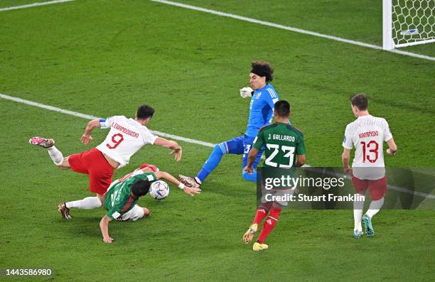 Hector Moreno of Mexico challenges Robert Lewandowski of Poland during the FIFA World Cup Qatar 2022 Group C match between Mexico and Poland at...