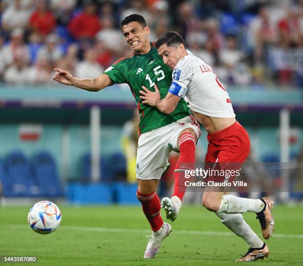 Hector Moreno of Mexico challenges Robert Lewandowski of Poland which leads to a Poland penalty during the FIFA World Cup Qatar 2022 Group C match...