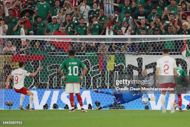 Robert Lewandowski of Poland shoots a penalty which is saved by Guillermo Ochoa of Mexico during the FIFA World Cup Qatar 2022 Group C match between...