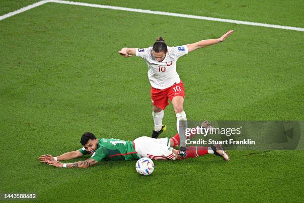 Grzegorz Krychowiak of Poland battles for possession with Alexis Vega of Mexico during the FIFA World Cup Qatar 2022 Group C match between Mexico and...