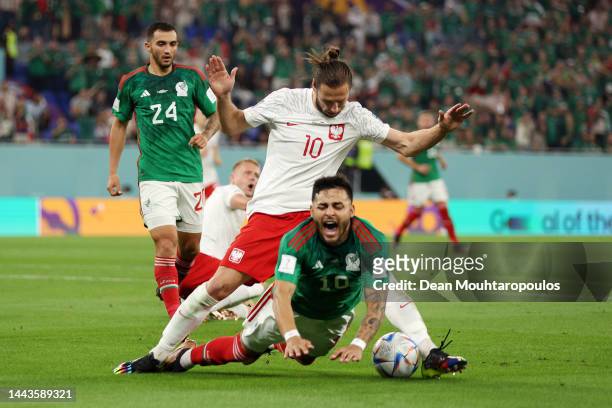 Alexis Vega of Mexico is challenged by Grzegorz Krychowiak of Poland during the FIFA World Cup Qatar 2022 Group C match between Mexico and Poland at...
