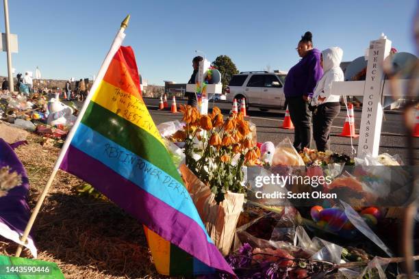 People visit a makeshift memorial near the Club Q nightclub on November 22, 2022 in Colorado Springs, Colorado. On November 19, a 22-year-old gunman...