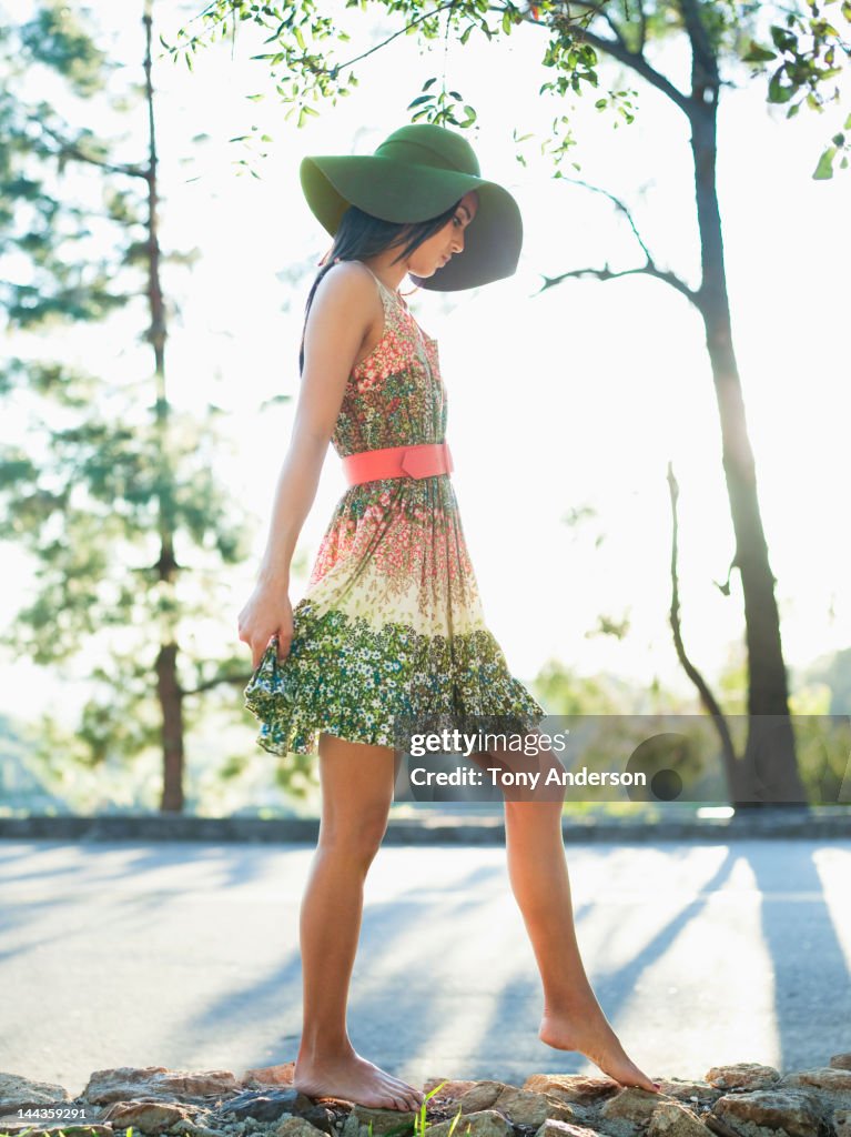 Woman walkiing on rock wall outdoors