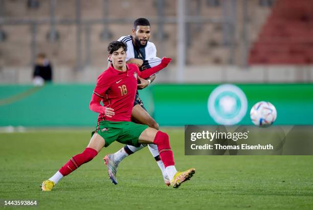 Jamil Siebert of Germany is challenged by Rodrigo Ribeiro of Portugal during the international friendly match between Germany U20 and Portugal U20 on...