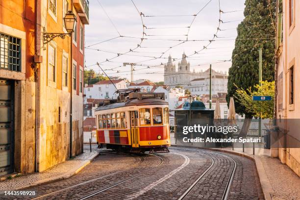 traditional old tram on the streets of lisbon old town, portugal - province de lisbonne photos et images de collection