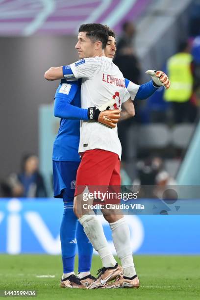 Guillermo Ochoa of Mexico and Robert Lewandowski of Poland embrace after the scoreless draw in the FIFA World Cup Qatar 2022 Group C match between...
