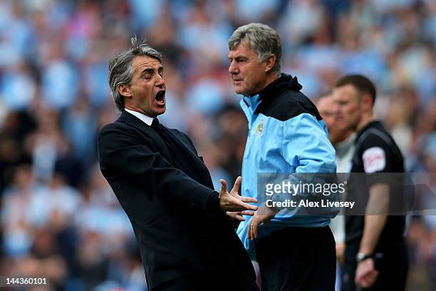 Roberto Mancini the manager of Manchester City reacts during the Barclays Premier League match between Manchester City and Queens Park Rangers at the...