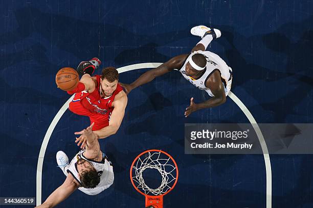 Blake Griffin of the Los Angeles Clippers shoots against Marc Gasol and Zach Randolph of the Memphis Grizzlies in Game Seven of the Western...