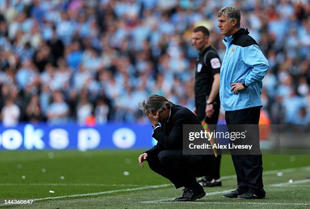 Roberto Mancini the manager of Manchester City reacts during the Barclays Premier League match between Manchester City and Queens Park Rangers at the...