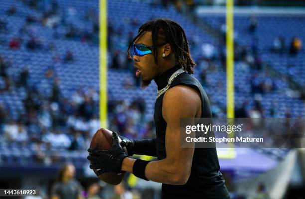 Justin Jefferson of the Minnesota Vikings warms up before the game against the Dallas Cowboys at U.S. Bank Stadium on November 20, 2022 in...