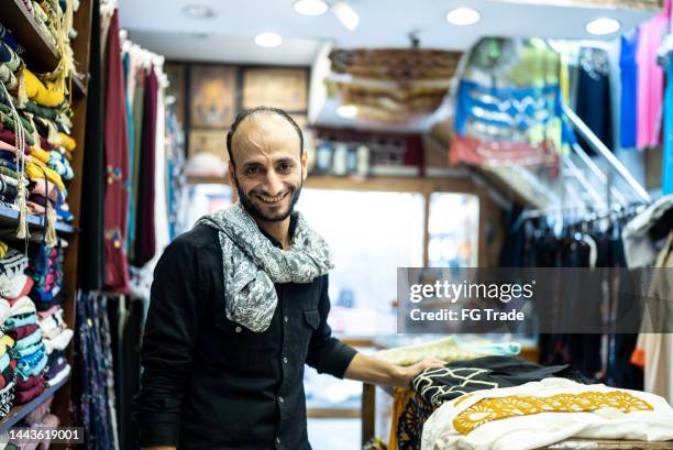 portrait of a business owner in his store - north african culture stock pictures, royalty-free photos & images