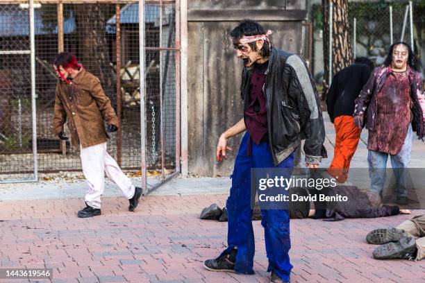 Madrid, SPAIN Actors perform as zombies in the zombie exit of 'The Walking Dead Experience Dark Session' at the Madrid Amusement Park on November 20,...