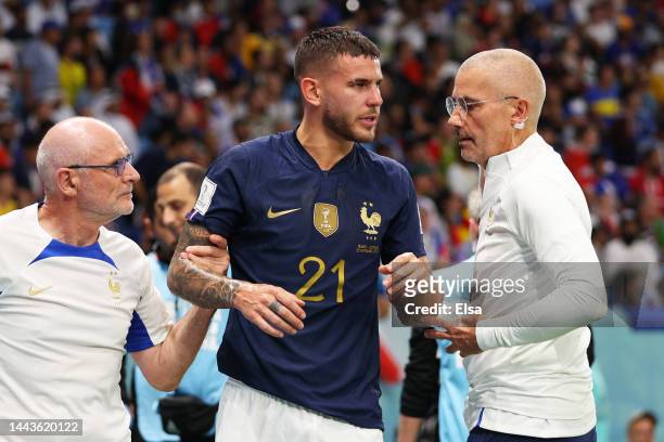 Lucas Hernandez of France is attended by medical staffs as he is substituted after an injury during the FIFA World Cup Qatar 2022 Group D match...
