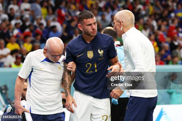 Lucas Hernandez of France is attended by medical staffs as he is substituted after an injury during the FIFA World Cup Qatar 2022 Group D match...