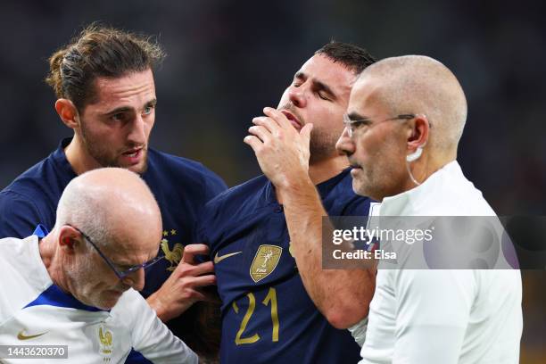 Lucas Hernandez of France shows dejection as he is substituted after an injury during the FIFA World Cup Qatar 2022 Group D match between France and...