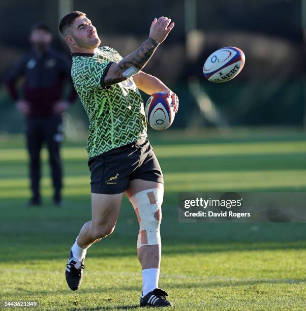 Malcolm Marx passes the ball during the South Africa Springboks training session held at The Lensbury on November 22, 2022 in Teddington, England.