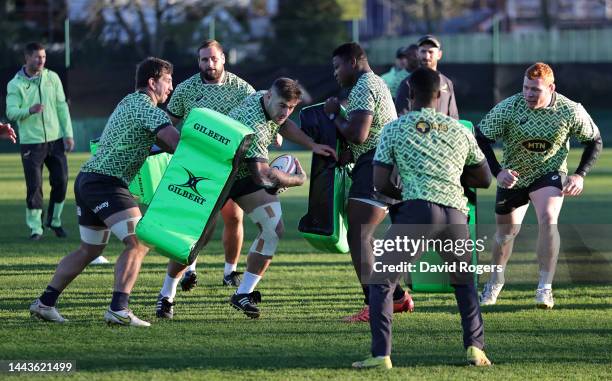 Malcolm Marx runs with the ball during the South Africa Springboks training session held at The Lensbury on November 22, 2022 in Teddington, England.