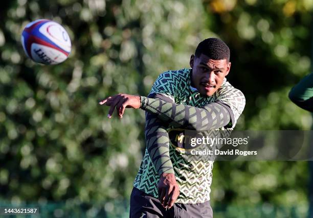 Damian Willemse passes the ball during the South Africa Springboks training session held at The Lensbury on November 22, 2022 in Teddington, England.