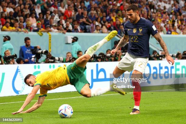 Mathew Leckie of Australia is challenged by Theo Hernandez of France during the FIFA World Cup Qatar 2022 Group D match between France and Australia...